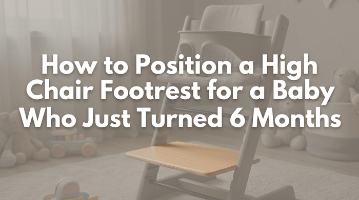 A 6-month-old baby sitting properly in a high chair with feet supported on footrest