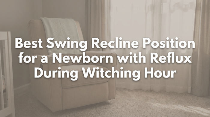 A newborn resting peacefully in a reclined baby swing with soft natural lighting
