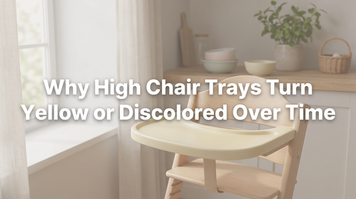 A yellowed high chair tray on a kitchen counter