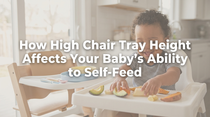 Baby sitting in high chair reaching for food on properly positioned tray