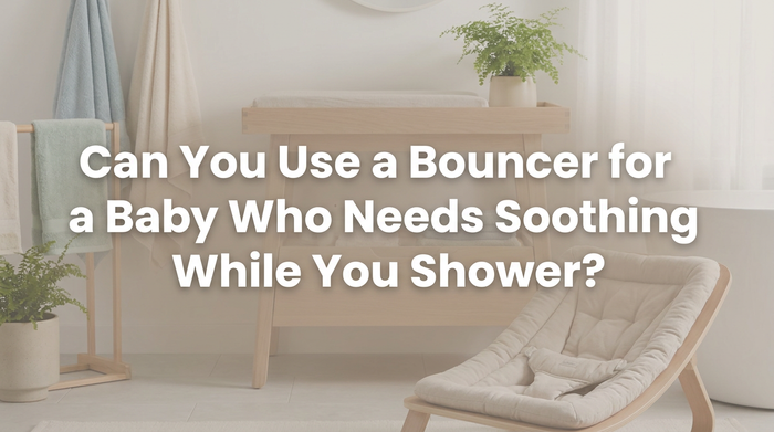 Parent placing baby in bouncer on bathroom floor with natural lighting