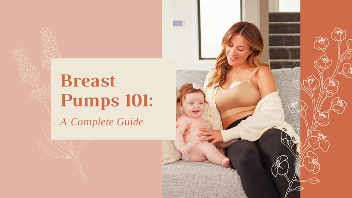 A mother wearing a Momcozy hands-free breast pump is comfortably sitting on a sofa while bonding with her baby.