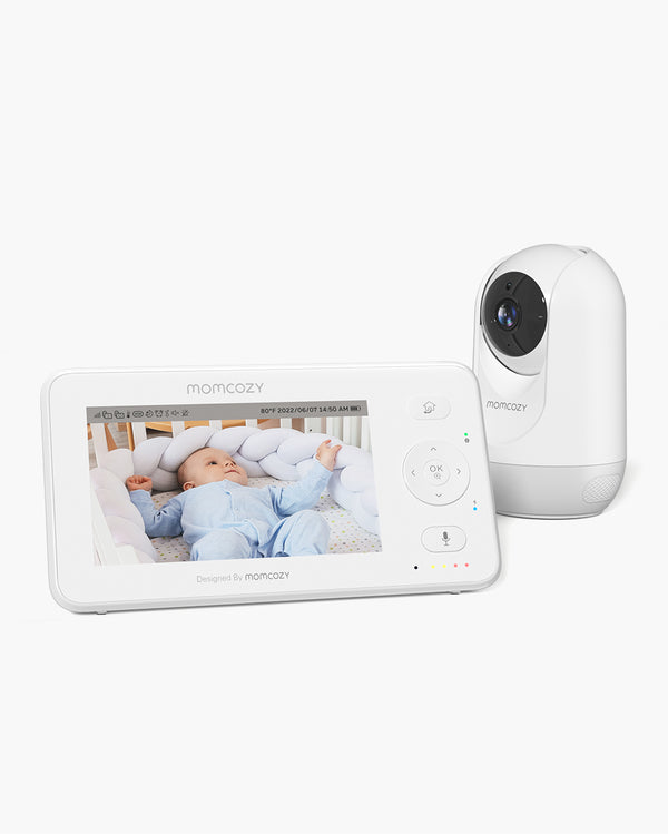Momcozy 4.3' HD Video Baby Monitor BM02 showing a baby sleeping on the monitor screen, with the camera unit beside the monitor.