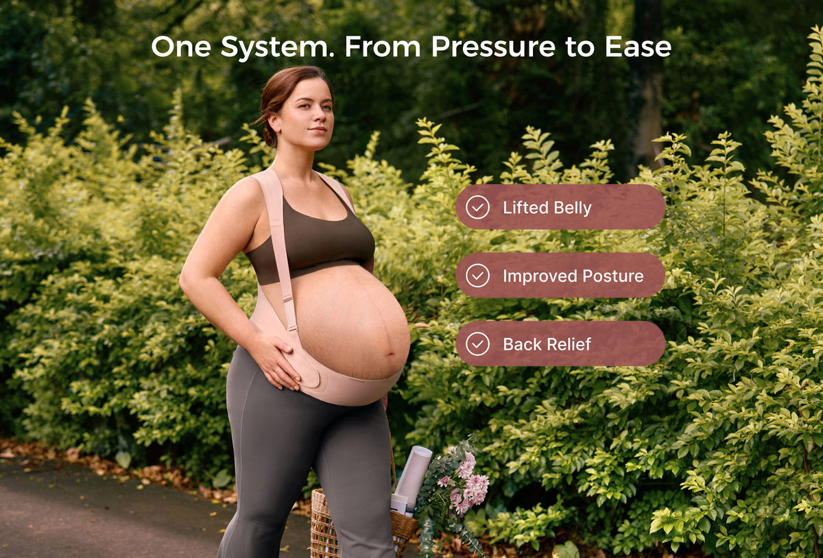 Pregnant woman outdoors wearing the oyster pink Momcozy belly band for belly lift, posture and back support.