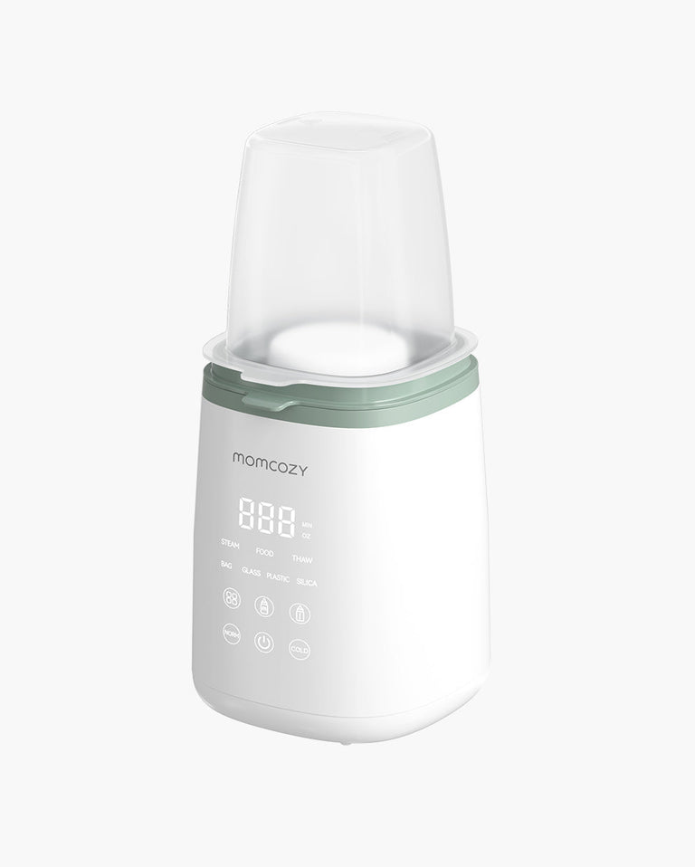Translation missing: de.Momcozy 6-in-1 Fast Baby Bottle Warmer with digital display, green top, and protective cover for warming bottles, heating food, and thawing frozen milk