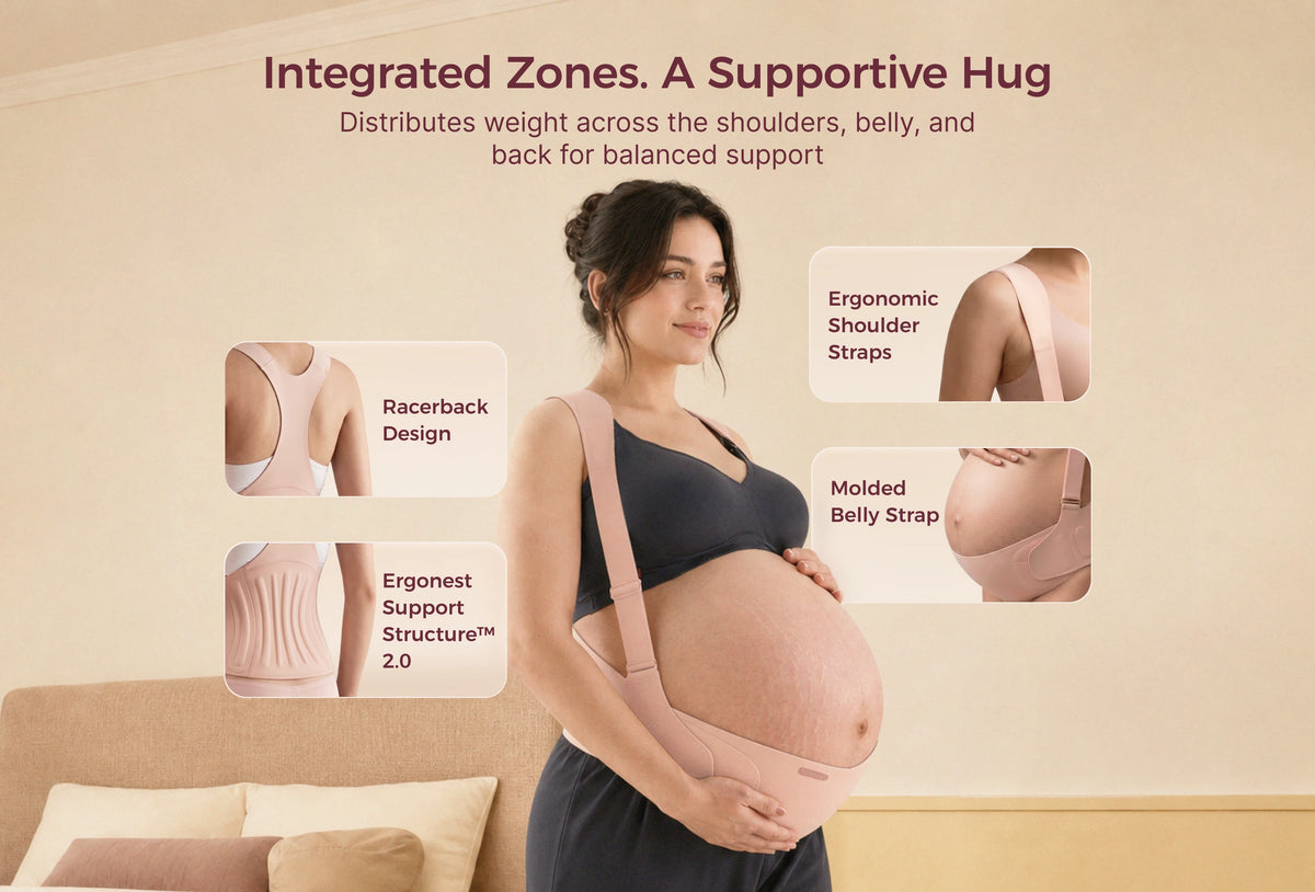 Pregnant woman wearing the oyster pink Momcozy maternity support band with racerback straps in a bedroom.