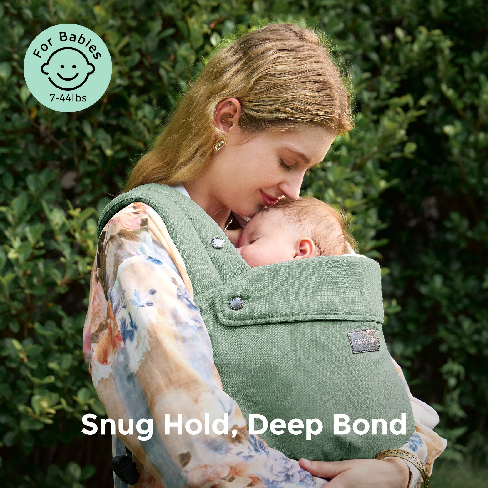 Sage green Momcozy baby carrier, mother babywearing newborn. Comfortable babywearing design, supporting 7-44lbs babies. Snug Hold, Deep Bond.