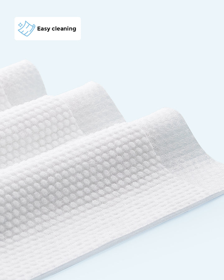 Close-up view of white textured 99% water wipes with 'Easy cleaning' icon and text in the corner, emphasizing their ease of use for cleaning.