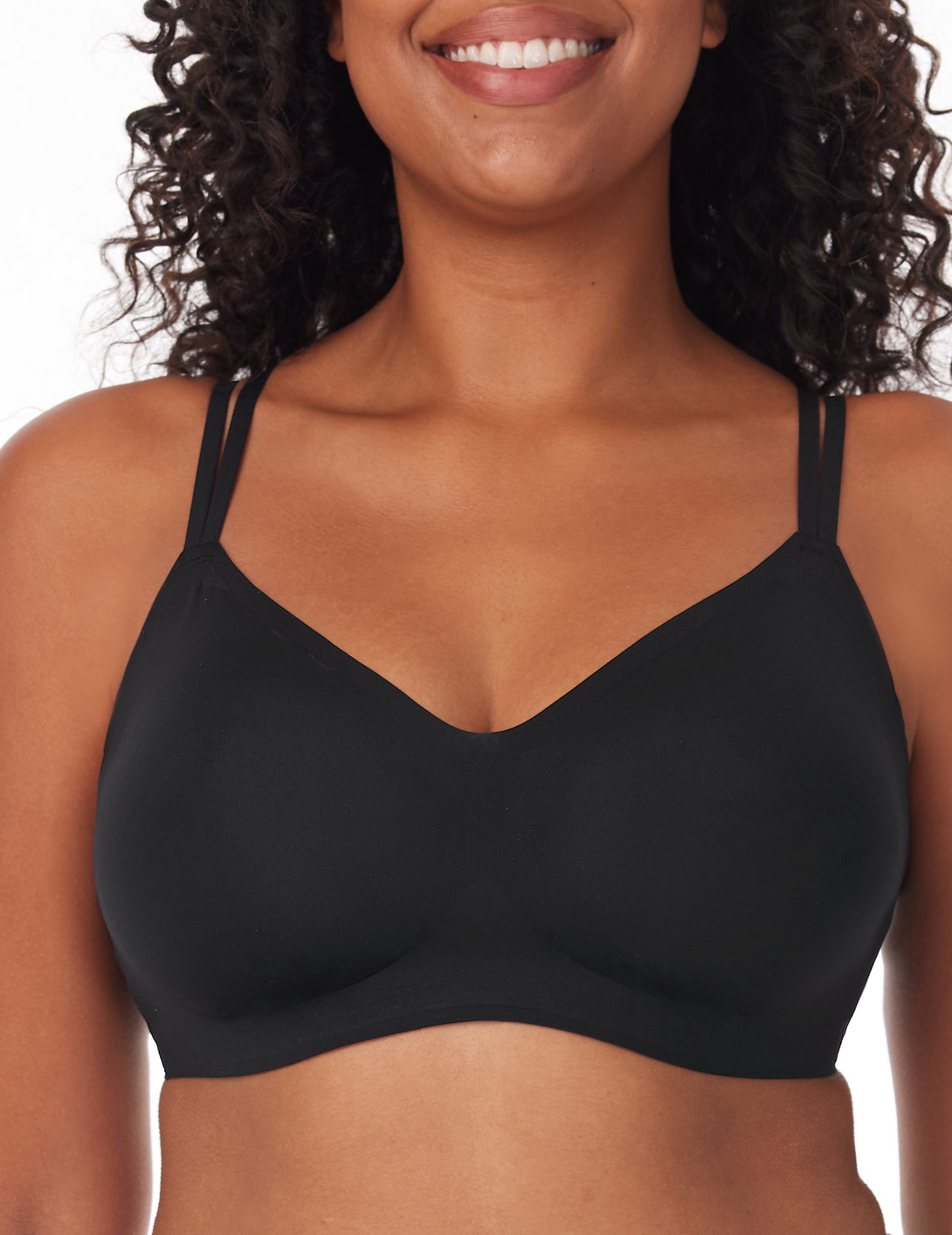 Woman wearing black Momcozy 3-in-1 FlexiStyle Convertible Everyday Bra, showcasing its seamless design and thin straps for comfort and support.