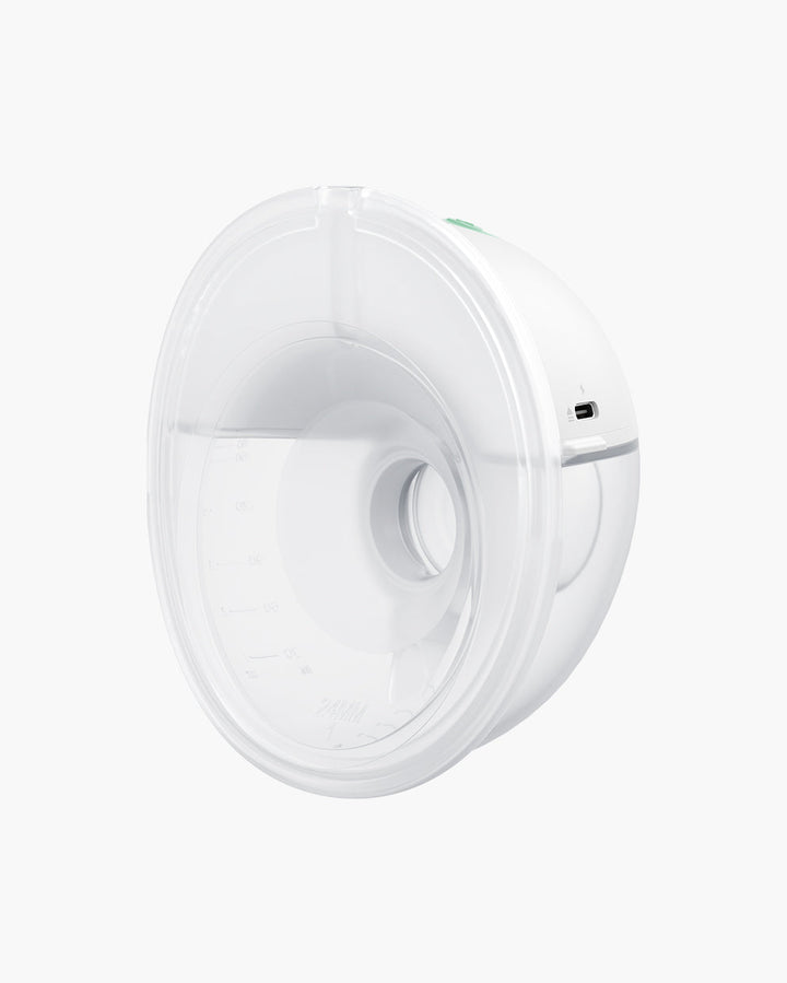 Close-up view of the All-in-one M5 Wearable Breast Pump displaying the transparent cup and charging port.