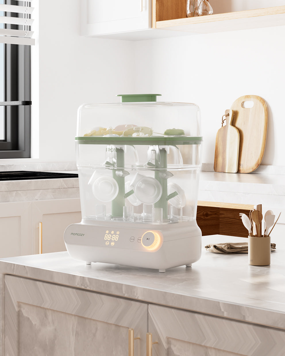 Momcozy 3 Layers Bottle Sterilizer and Dryer with LED display on kitchen countertop.