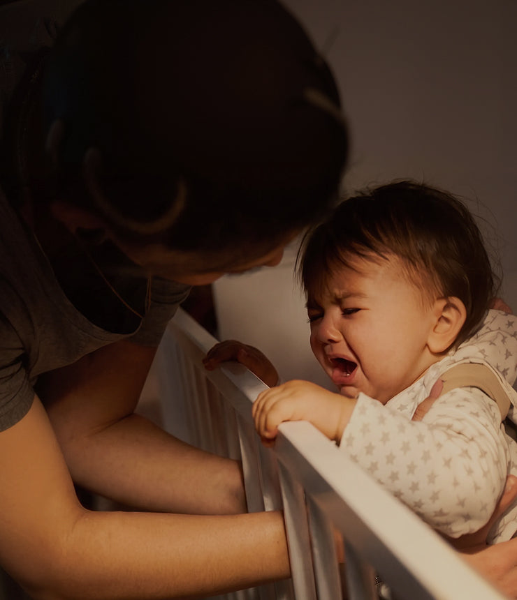 Parent preparing a nighttime feed