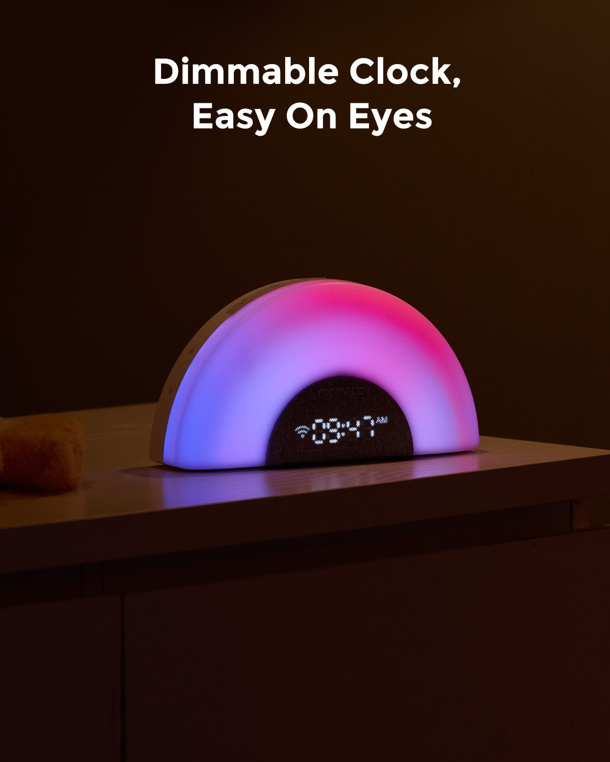 Momcozy DreamSync baby sound machine with rainbow light, dimmable clock, and easy-on-eyes display.