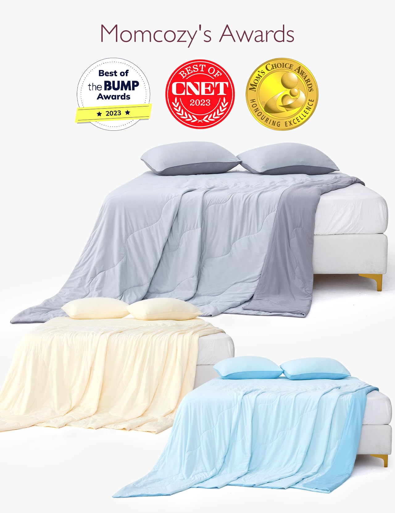 Momcozy award-winning cooling comforters in gray, cream beige, and blue with pillows on a bed.
