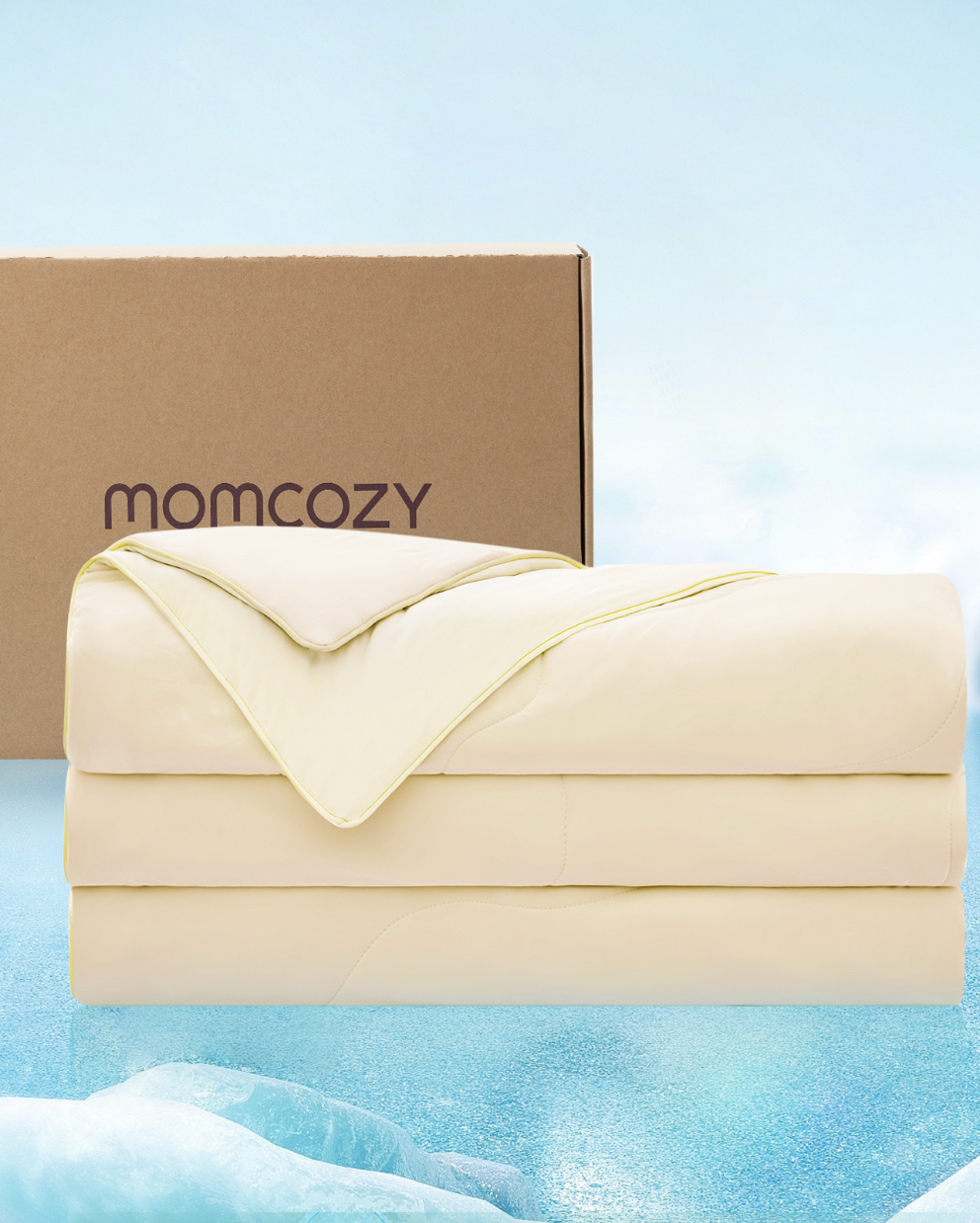 Soft beige Momcozy cooling comforter with packaging in tranquil blue atmosphere.