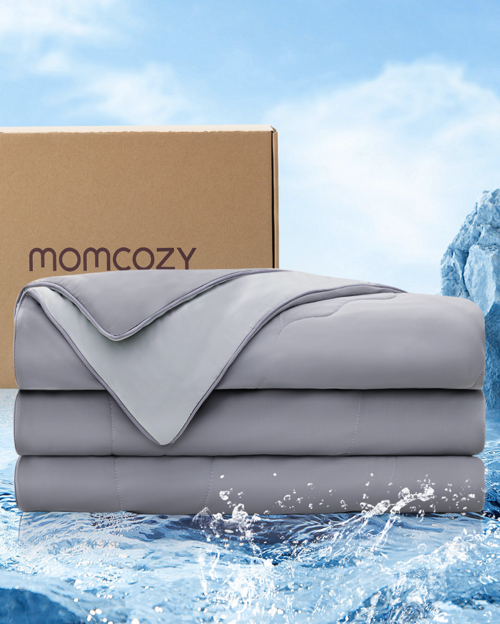 Momcozy CoolMurm™ grey cooling comforter paired with packaging on a blue water backdrop.
