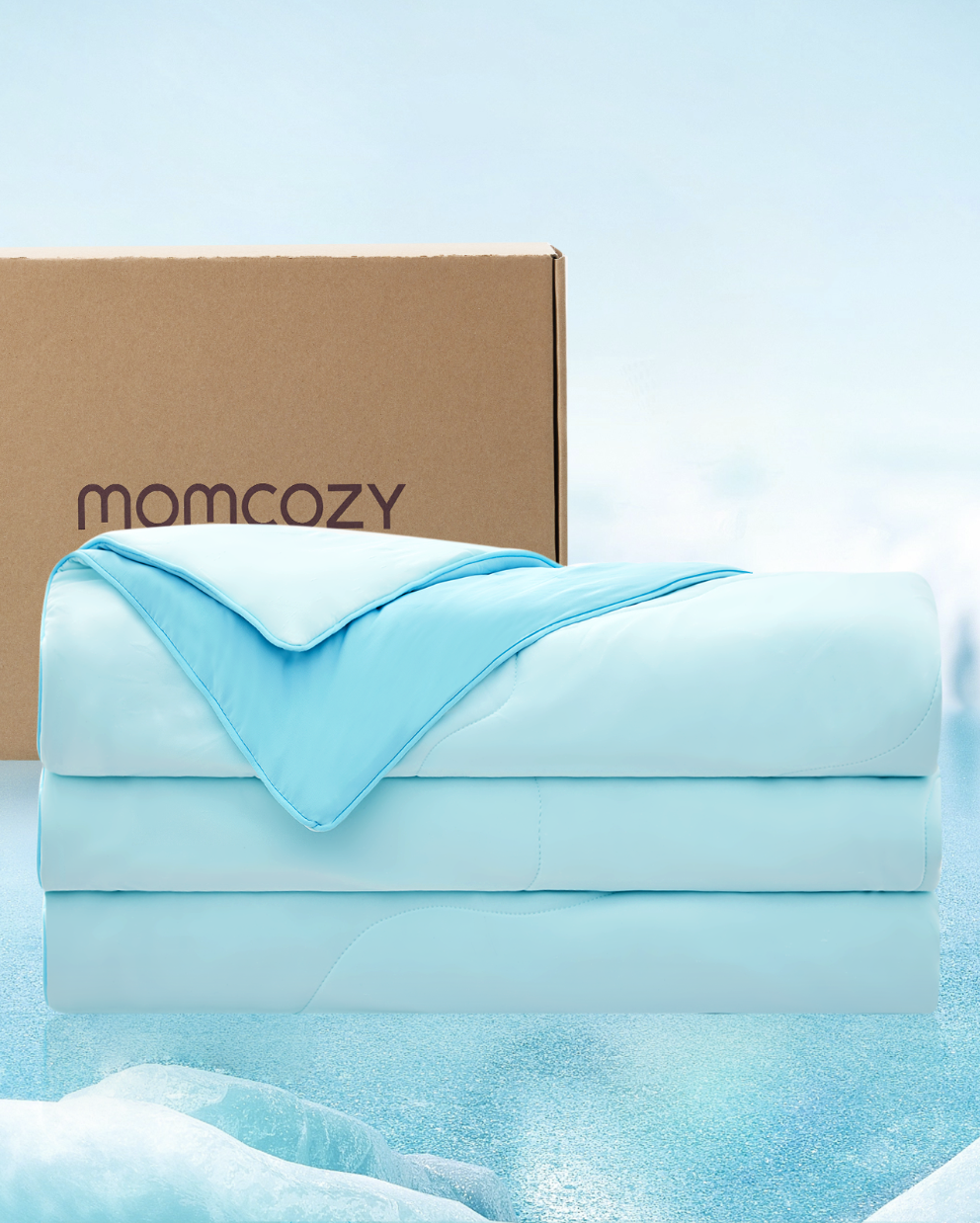 Momcozy CoolMurm™ cooling comforter in blue next to branded packaging.