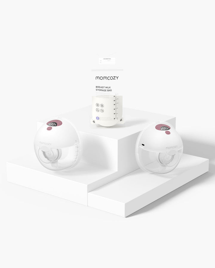 Momcozy All-in-one M5 Wearable Breast Pump with two pump units and a breast milk storage bag on display platform