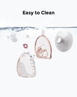 Momcozy Air 1 breast pump parts in water, showcasing easy-to-clean design with measurement markings.