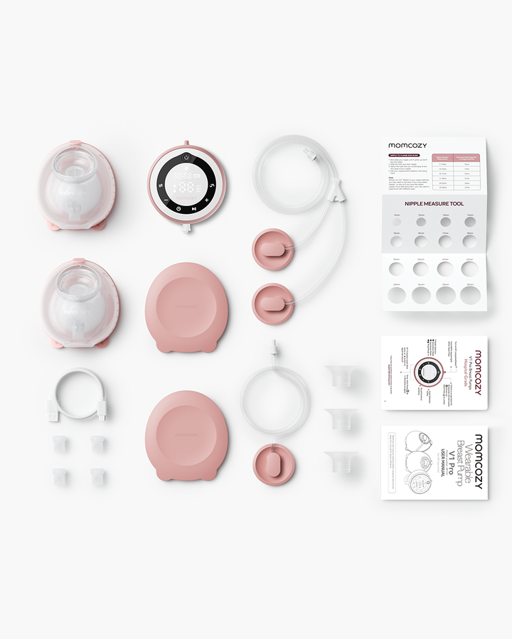 Momcozy V1 Pro breast pump components in pink, including collection cups and user manuals.