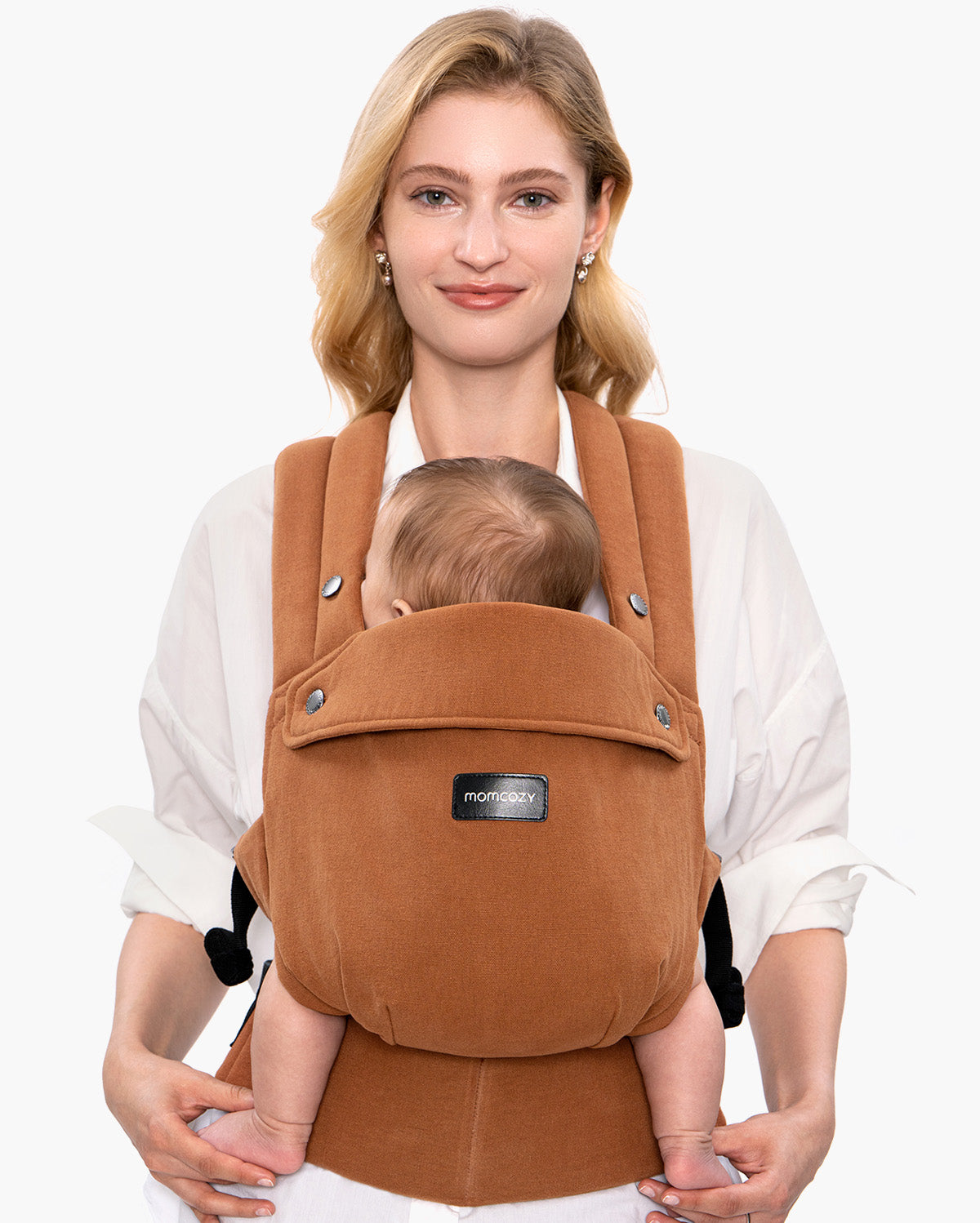 Momcozy GentleTouch baby carrier in brown, holding baby comfortably; showcasing stylish and comfortable mom care.