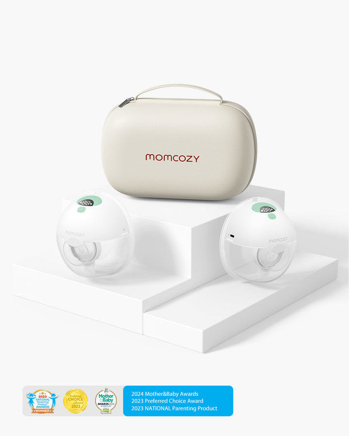 Momcozy M5 wearable breast pumps with beige carrying case, displayed on a white platform, and award badges for Mother&Baby, Preferred Choice, and NATIONAL Parenting Product.